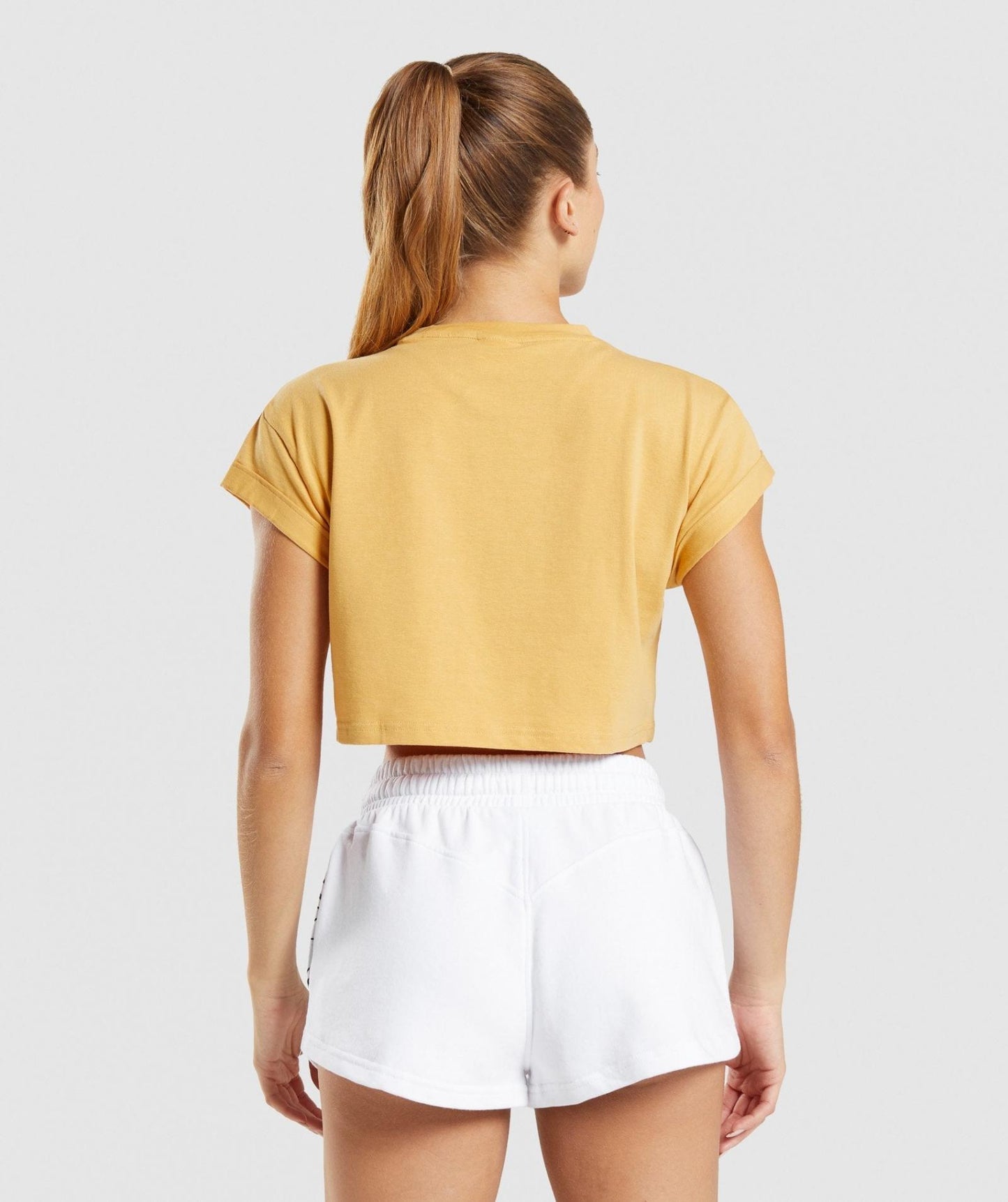 GYMSHARK LEGACY GRAPHIC CROP TEE YELLOW MARŠKINĖLIAI